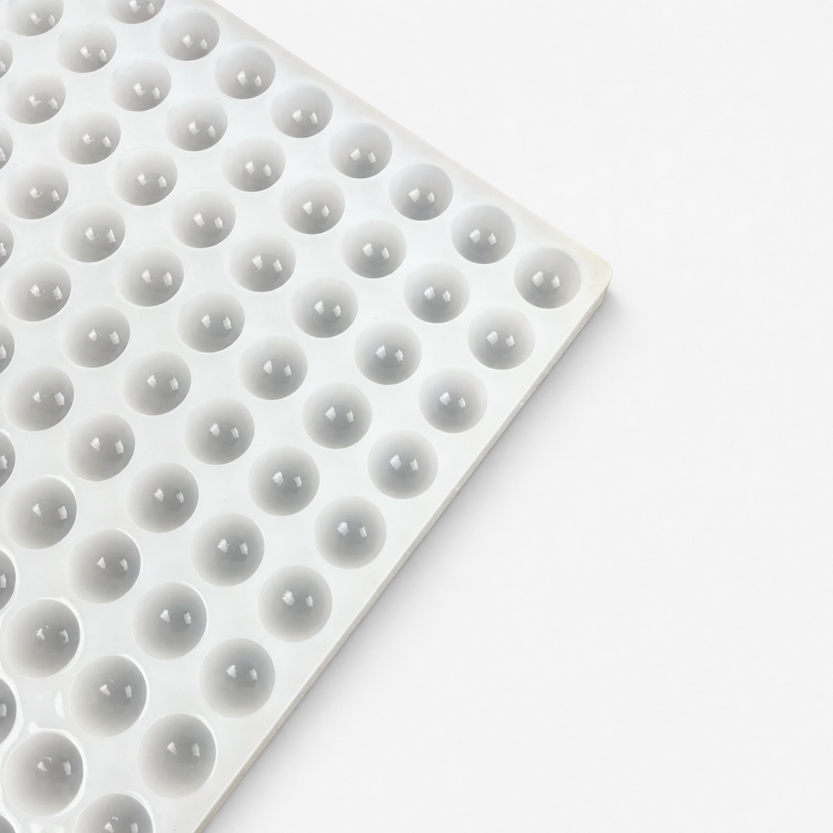 Close-up of commercial silicone mold cavities showing the finished silicone surface and cavity detail