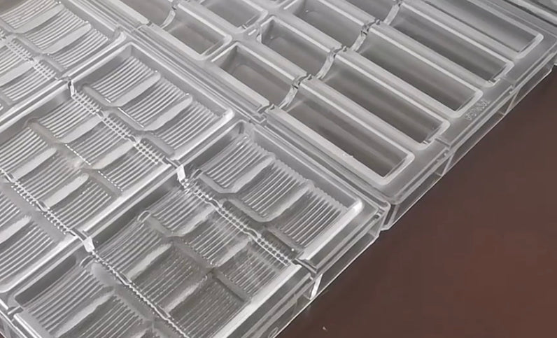 Clear chocolate molds made from polycarbonate plastic.